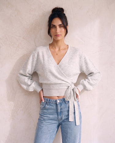 The Calira Wrap Knit in gray — knit wrap top, front view on model