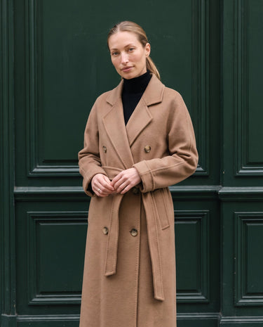The Calvera double-breasted wool coat in khaki — front view on model
