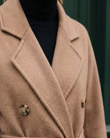 The Calvera double-breasted wool coat in khaki — close-up of the notch collar and lapel