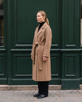 The Calvera double-breasted wool coat in khaki — side view on model