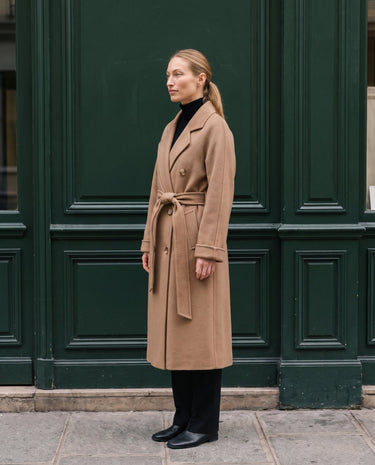 The Calvera double-breasted wool coat in khaki — side view on model