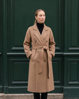 The Calvera double-breasted wool coat in khaki — front view on model