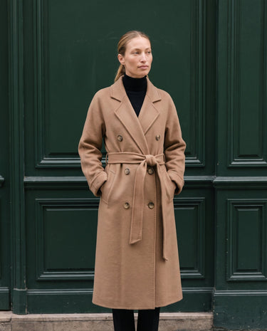The Calvera double-breasted wool coat in khaki — front view on model