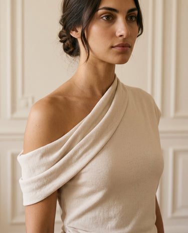 The Camellia Ruffle Top in beige — close-up of off-shoulder neckline and soft draping