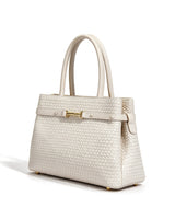 The Camille Handbag in ivory, three-quarter studio view showing the structured shape and rolled top handles