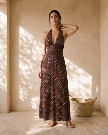 The Capri Polka Dot Dress in brown — polka-dot halter maxi dress, front view on model