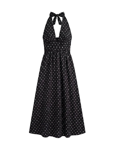 The Capri Polka Dot Dress in black — polka-dot halter maxi dress with V-neck, product flat-lay