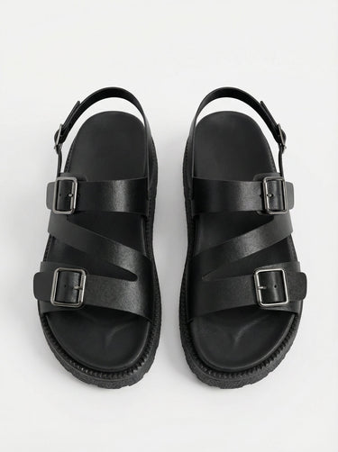 The Celeste Sandal in black — double buckle strap sandals, top-down pair view