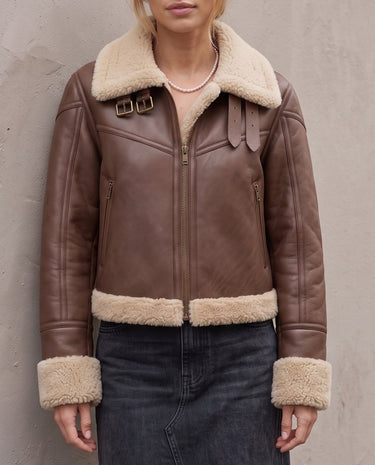 The Cerys Fur Collar Jacket in coffee — faux-leather jacket with faux fur collar, front view on model