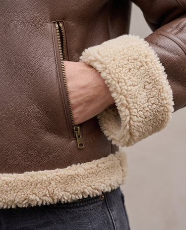 The Cerys Fur Collar Jacket in coffee — close-up of faux fur cuff, hem and zip pocket