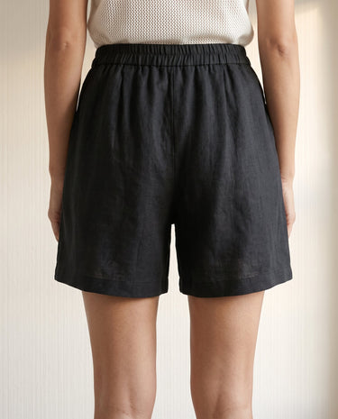 The Ciente Cotton Shorts in black — cotton shorts, back view on model
