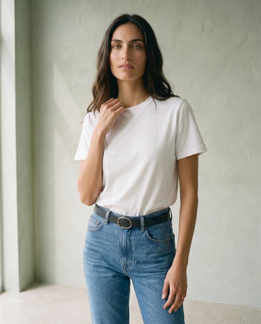 The Cotton Everyday Tee in white — crew-neck cotton t-shirt, front three-quarter view on model