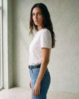 The Cotton Everyday Tee in white — crew-neck cotton t-shirt, side view on model
