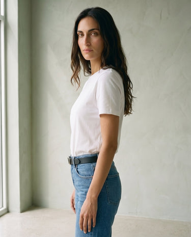 The Cotton Everyday Tee in white — crew-neck cotton t-shirt, side view on model