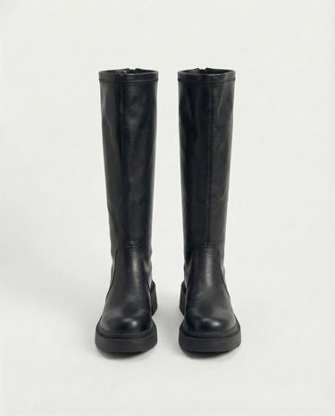 The Elara Slim Riding Boots in black — knee-high riding boots, front view