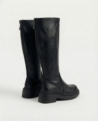 The Elara Slim Riding Boots in black — knee-high riding boots with back zip, side view
