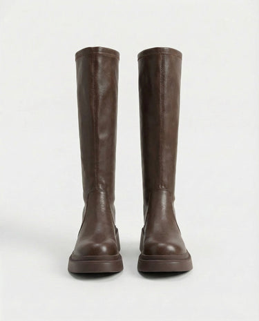 The Elara Slim Riding Boots in brown — knee-high riding boots, front view
