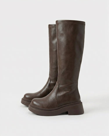The Elara Slim Riding Boots in brown — knee-high riding boots, side view