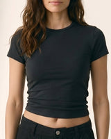 Model wearing black fitted crew-neck cropped tee with black cargo trousers, front view – Moriel Heritage