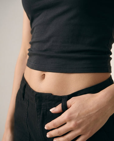 Close-up of black cropped tee showing ribbed side and cropped hem – Moriel Heritage