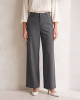 The Elin Wide Leg Tailored Pants in dark gray — wide-leg suit trousers, front view on model