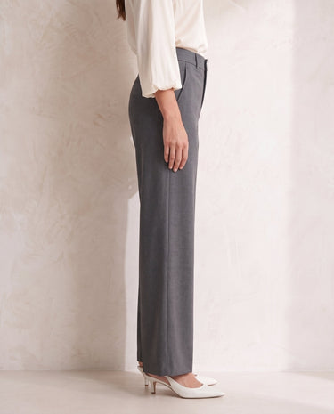 The Elin Wide Leg Tailored Pants in dark gray — wide-leg suit trousers, side view on model