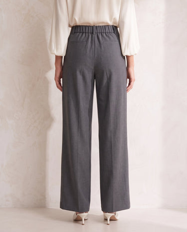The Elin Wide Leg Tailored Pants in dark gray — wide-leg suit trousers, back view on model