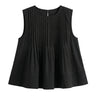 The Elio Pleat Vest in black — sleeveless pin-tuck pleated swing top, product flat-lay