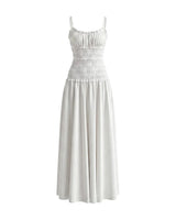 The Elire Dress in white — shirred bodice tiered maxi dress with thin straps, product front view