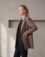 The Elle Blazer in brown — side view on model