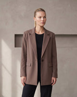 The Elle Blazer in brown — front view on model