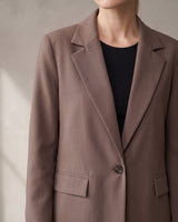 The Elle Blazer in brown — close-up of the notch lapel and single button