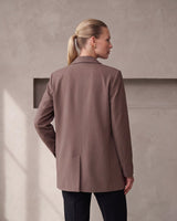 The Elle Blazer in brown — back view on model