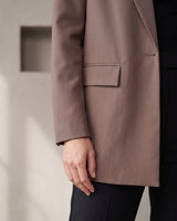 The Elle Blazer in brown — close-up of the flap pocket and sleeve