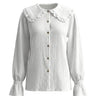 The Elodie Cotton Ruffle Collar Blouse in white — ruffle-collar button-front cotton blouse, product flat-lay
