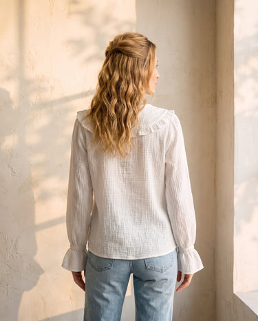 The Elodie Cotton Ruffle Collar Blouse in white — ruffle-collar blouse, back view on model