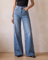 The Elodie jeans in blue — full-length front view on model