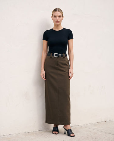 The Eloise Tailored Skirt in brown — straight maxi skirt, full front view on model