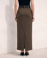 The Eloise Tailored Skirt in brown — straight maxi skirt with back slit, back view on model