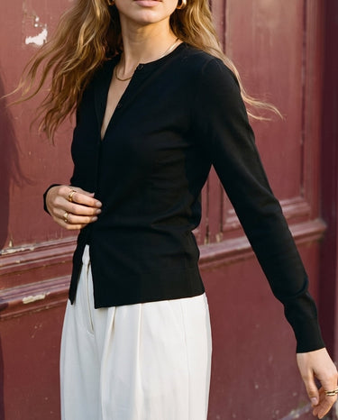 The Elsa Cardi in black — front view on model