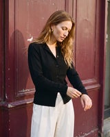 The Elsa Cardi in black — front view on model