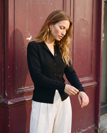 The Elsa Cardi in black — front view on model