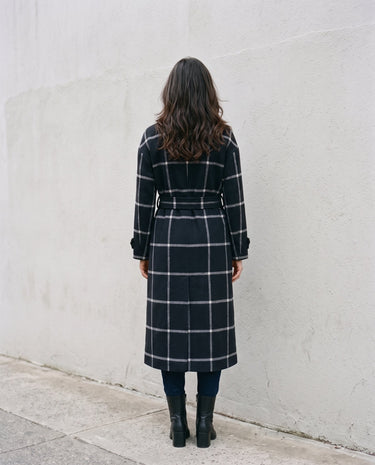 The Emilia Grid Longline Coat in black windowpane check — longline coat, back view on model