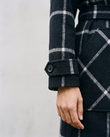 The Emilia Grid Longline Coat in black windowpane check — close-up of cuff and patch pocket