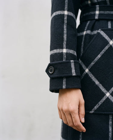 The Emilia Grid Longline Coat in black windowpane check — close-up of cuff and patch pocket