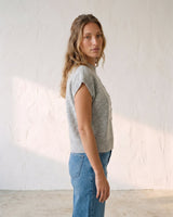 The Floral Embroider Top in light gray — mock-neck knit top, side view on model