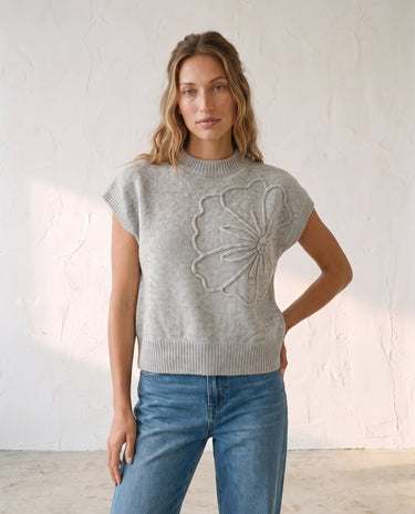 The Floral Embroider Top in light gray — short-sleeve knit top, three-quarter view on model