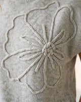 The Floral Embroider Top in light gray — close-up of raised floral embroidery detail