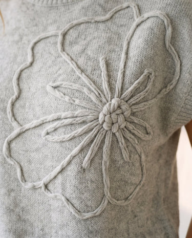 The Floral Embroider Top in light gray — close-up of raised floral embroidery detail