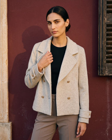 The Georgia Wool Coat in beige — double-breasted coat, front view on model